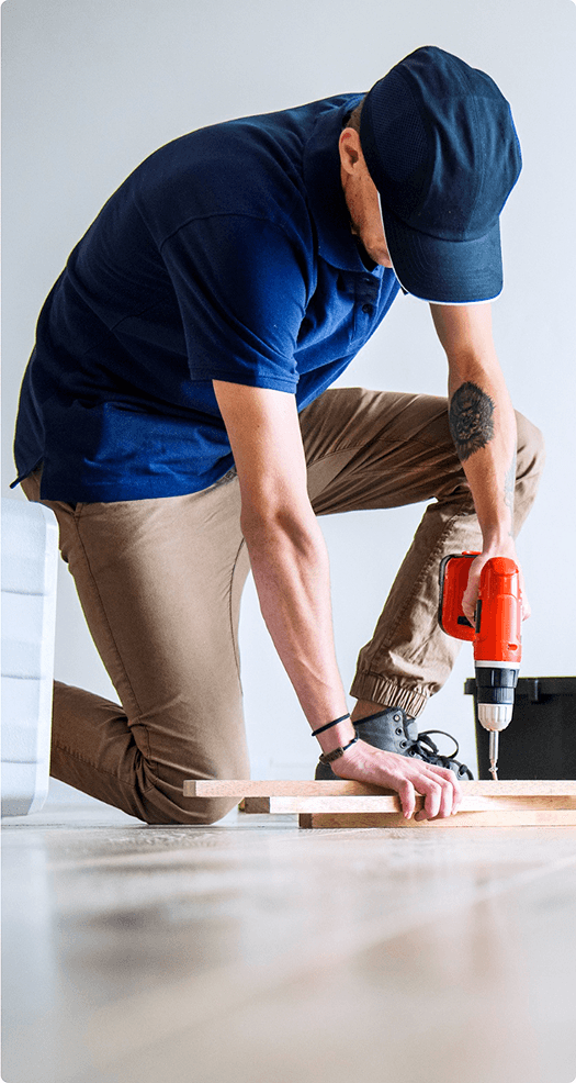 Professional artisan working on flooring